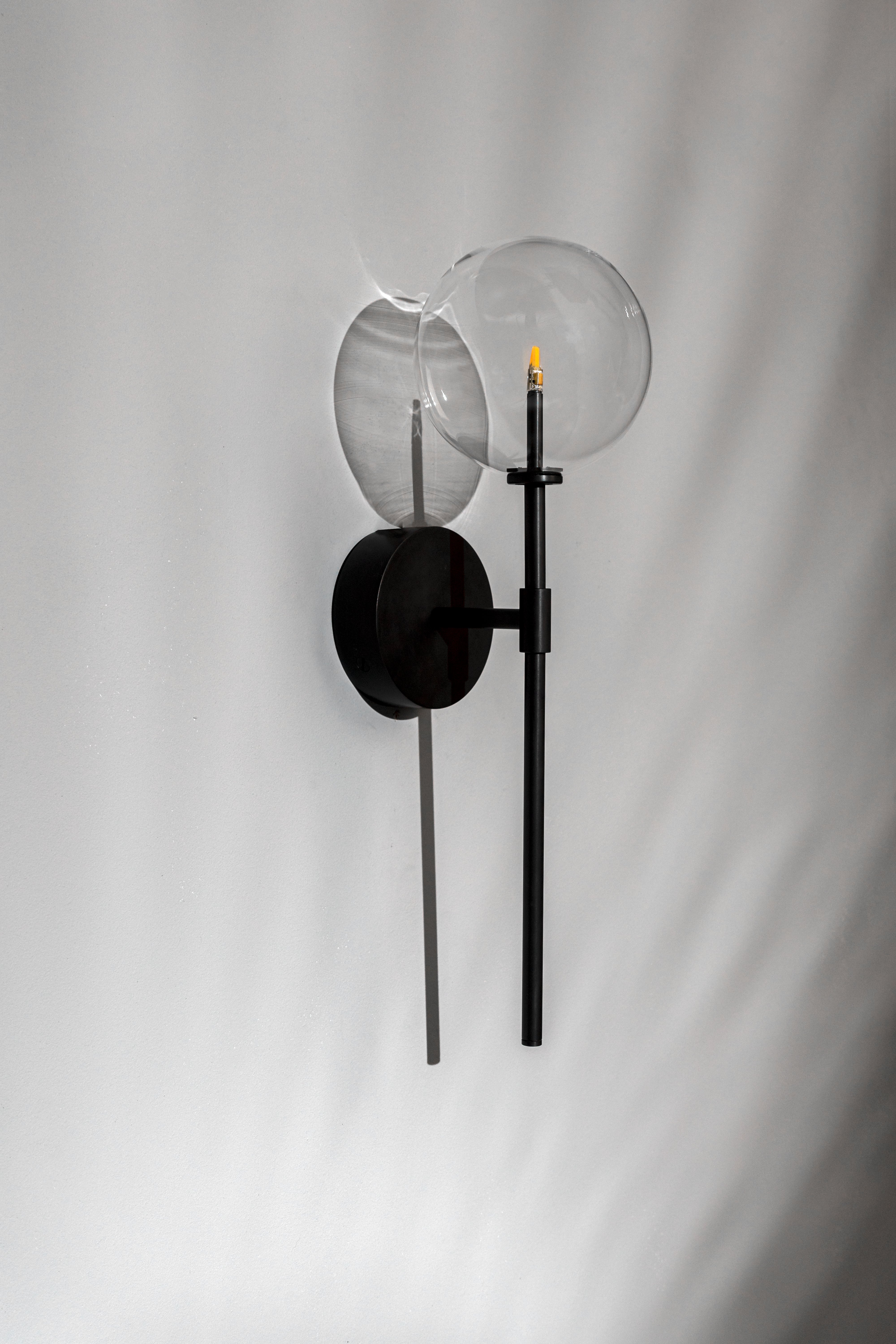 Schwung Dawn Single Black Gunmetal Transparent Globe Wall Light